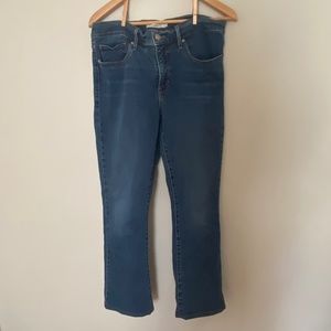 Levi’s Dark Wash Woman’s Large Shaping Bootcut Jeans (31)